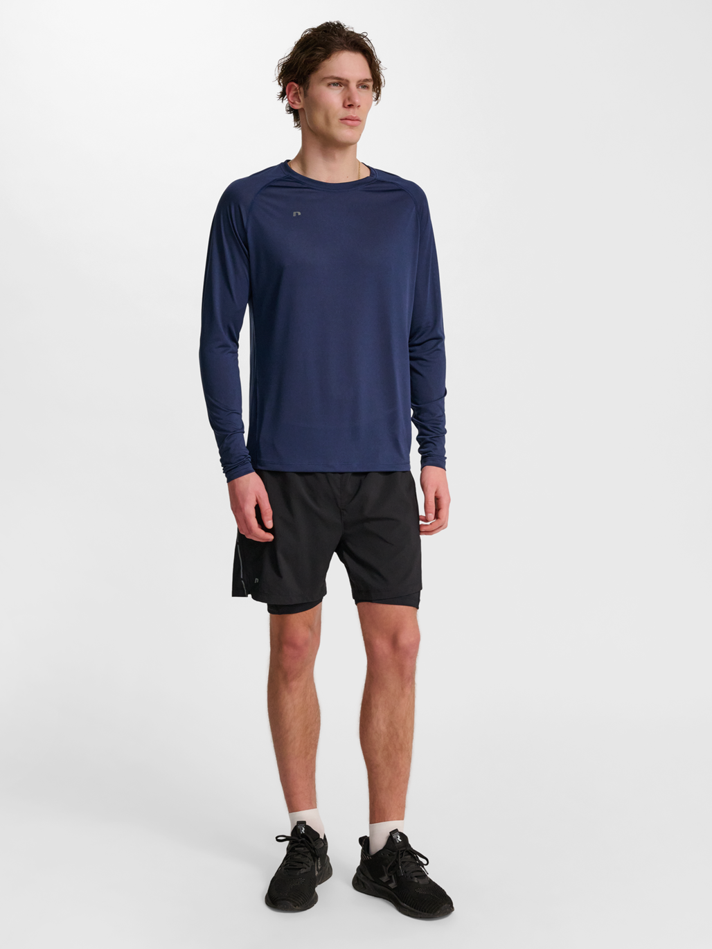 Men's long-sleeve running shirt in Black Iris, side view on model