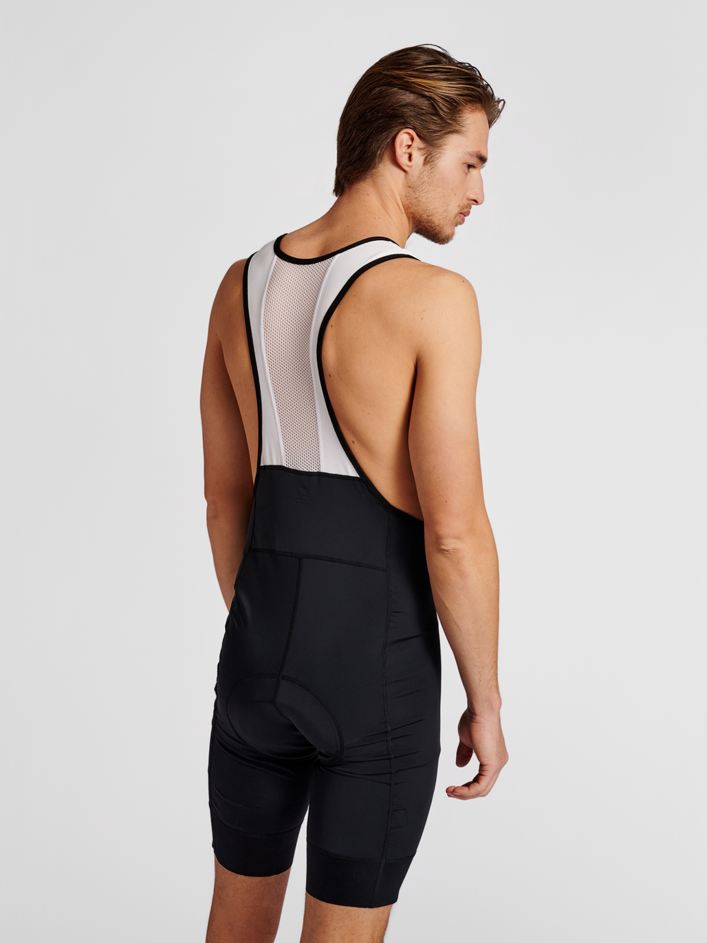 Men's cycling bib shorts in black/white, back view