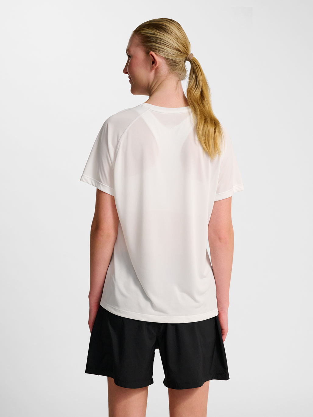 Women's white running t-shirt, side view on model