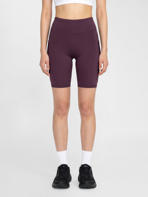 Women's plum high-waist short running tights, front view on model