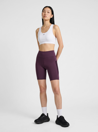Women's plum high-waist short running tights, back view on model