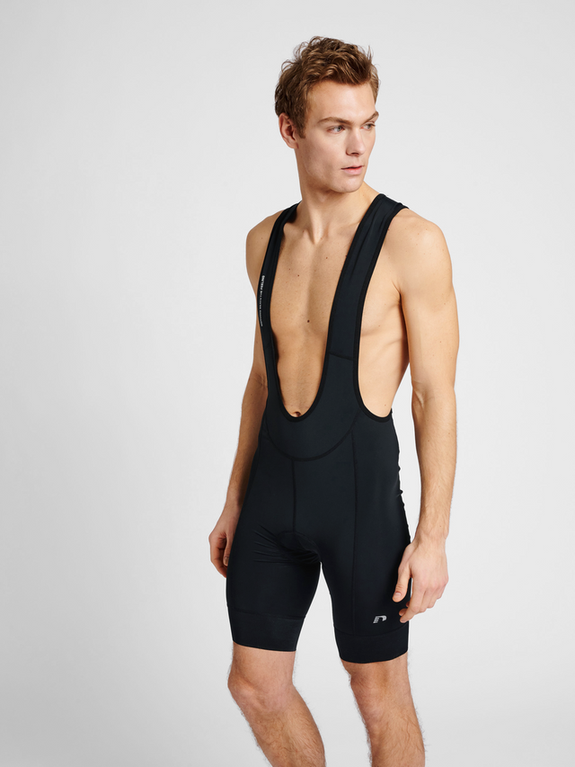Men's cycling bib shorts in black, front view on model